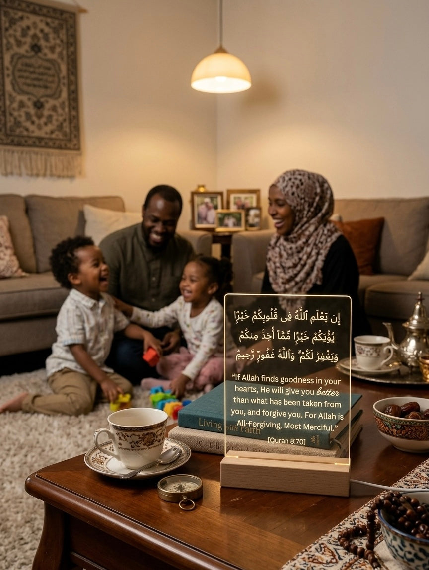 Family gathered in a living room with a Quranic verse plaque on a table.